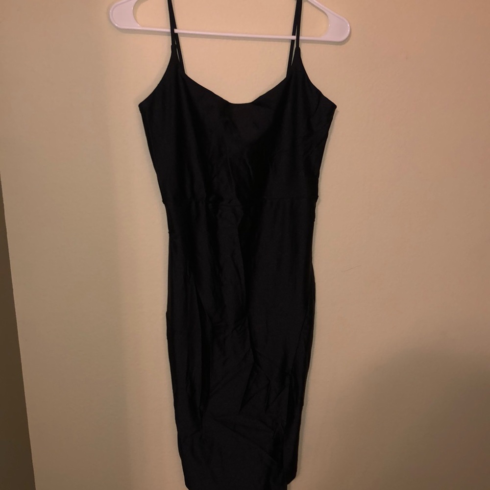 Black bodycon mini dress with criss cross tie in back. Size large.